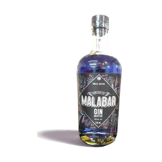 Botella Malabar Aflora 700 ml: gin mestizo chileno azul con flor de mariposa que cambia de color a rosa